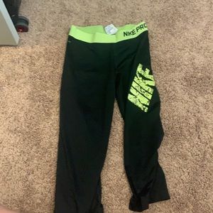 Nike black and neon yellow crop leggings